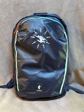 cotopaxi Navy Backpack with Mint Trim and Orange Pulls